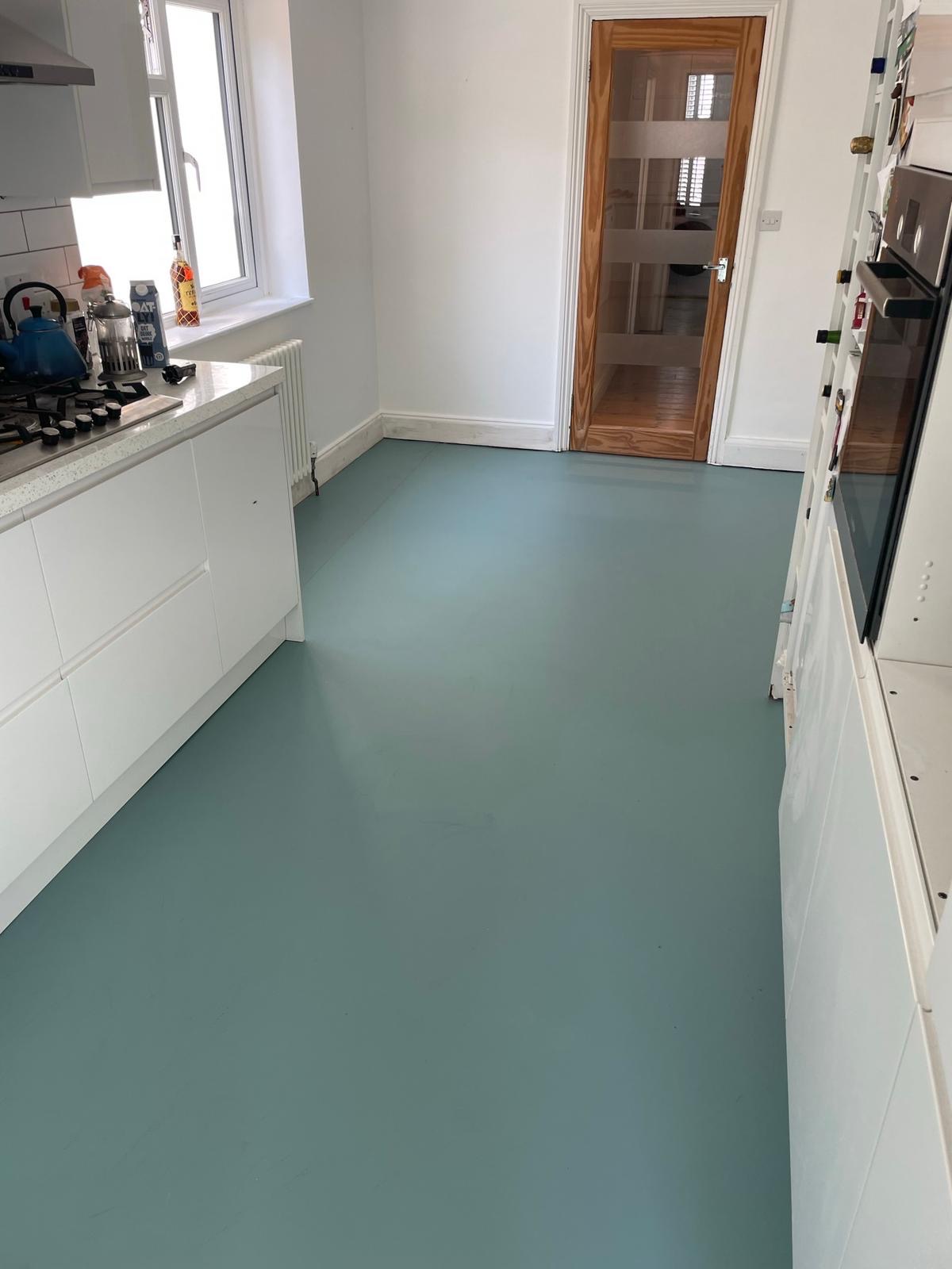 Sea-green Colour Flooring installed in a kitchen