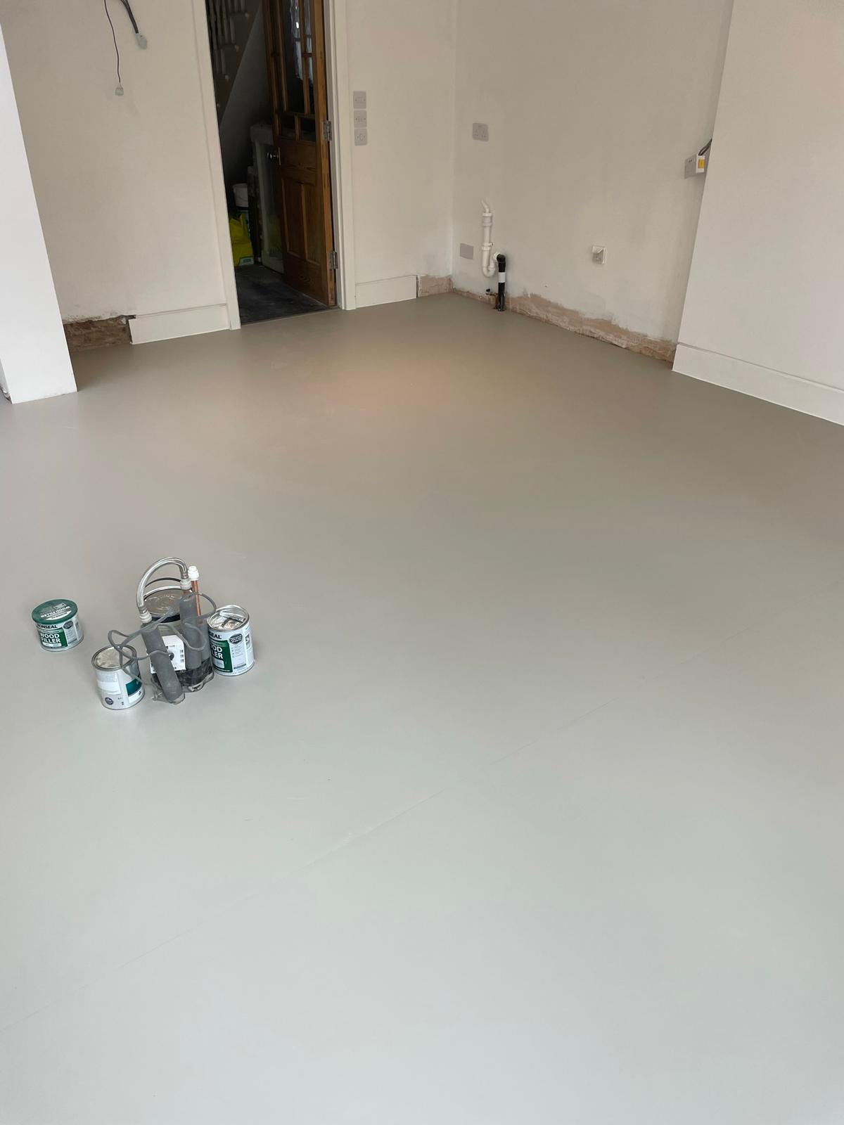 Pale-grey Colour Flooring installed in an open-plan room
