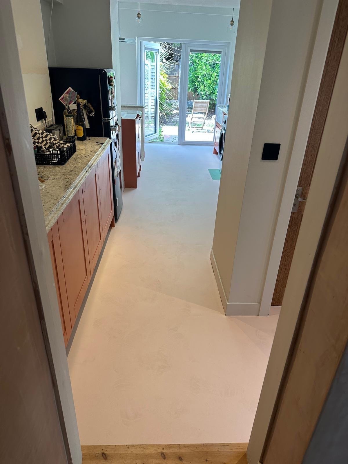 Primer applied across the kitchen subfloor
