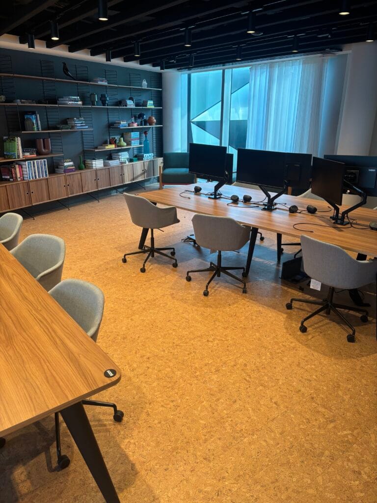 Warm cork flooring in a bright open-plan office