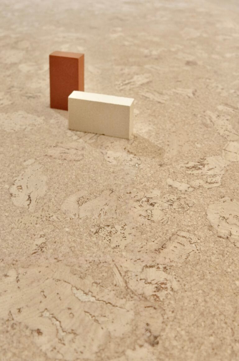 Close-up of pale glue-down cork floor tiles