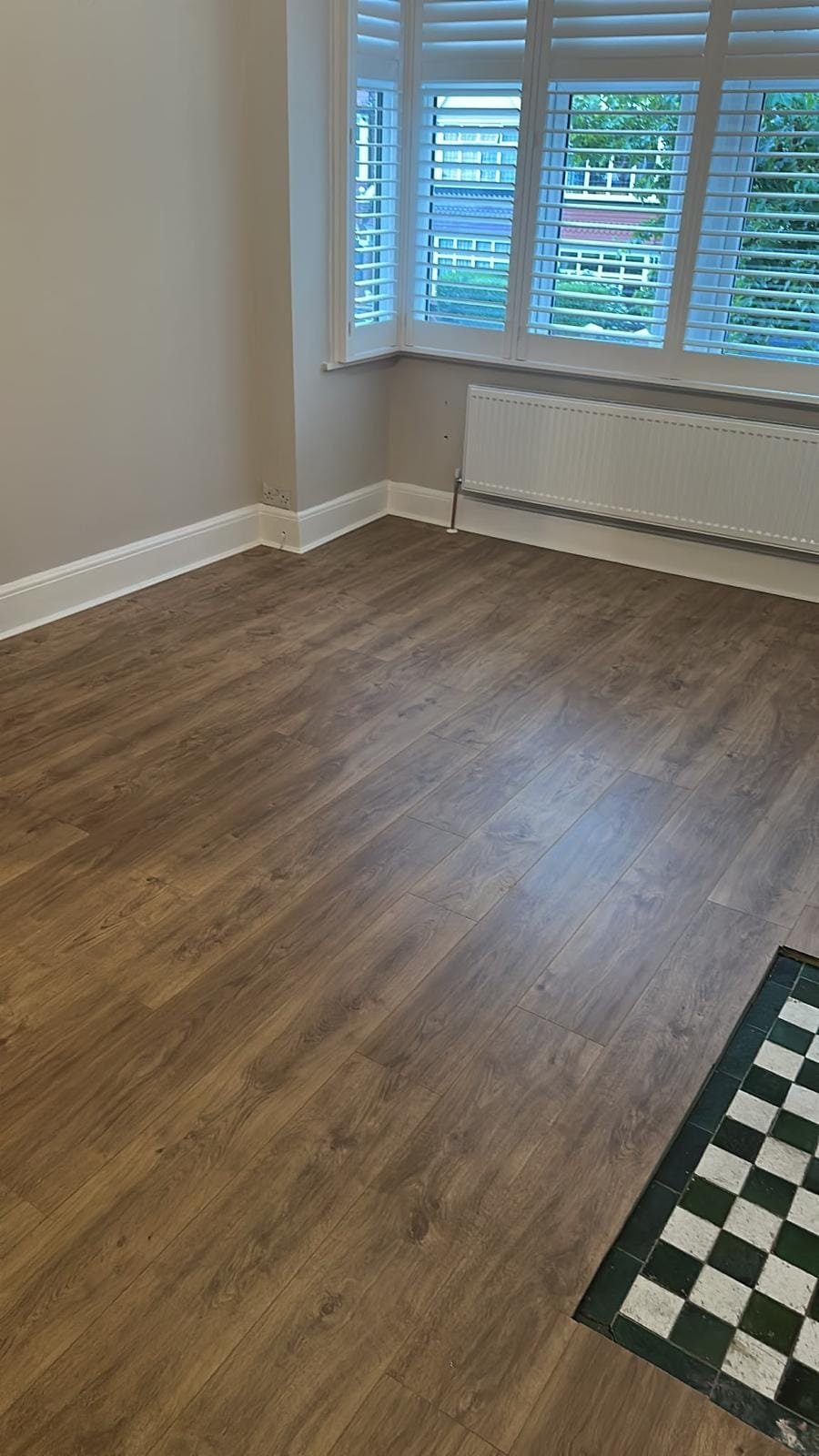 New laminate flooring installed with scotia beading