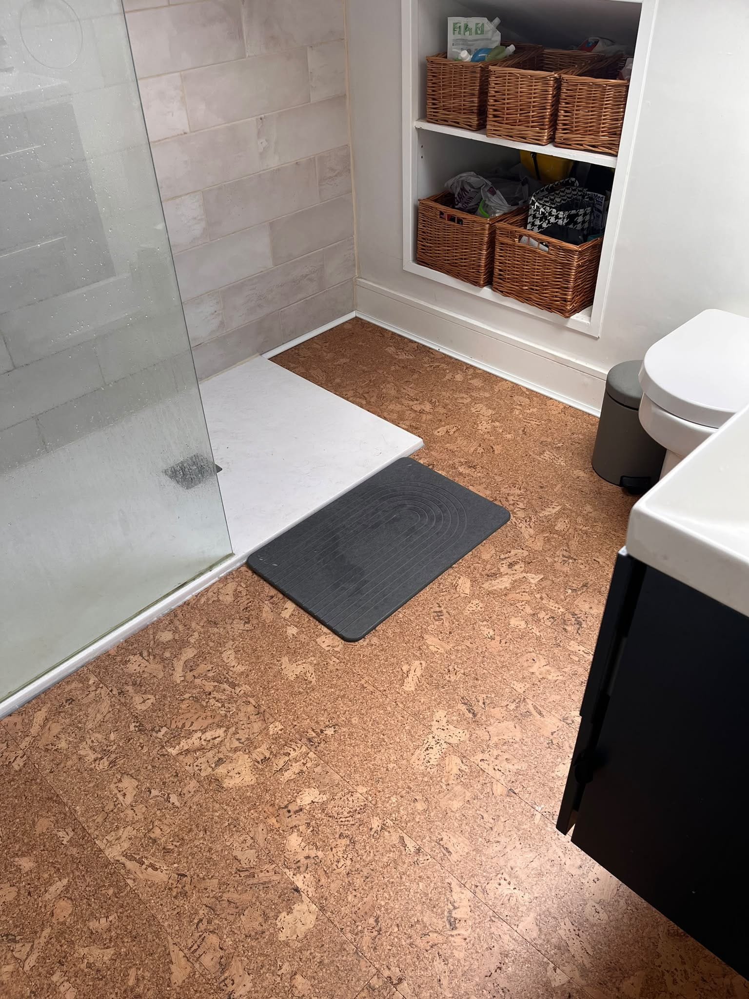 Cork floor fitted around a walk-in shower