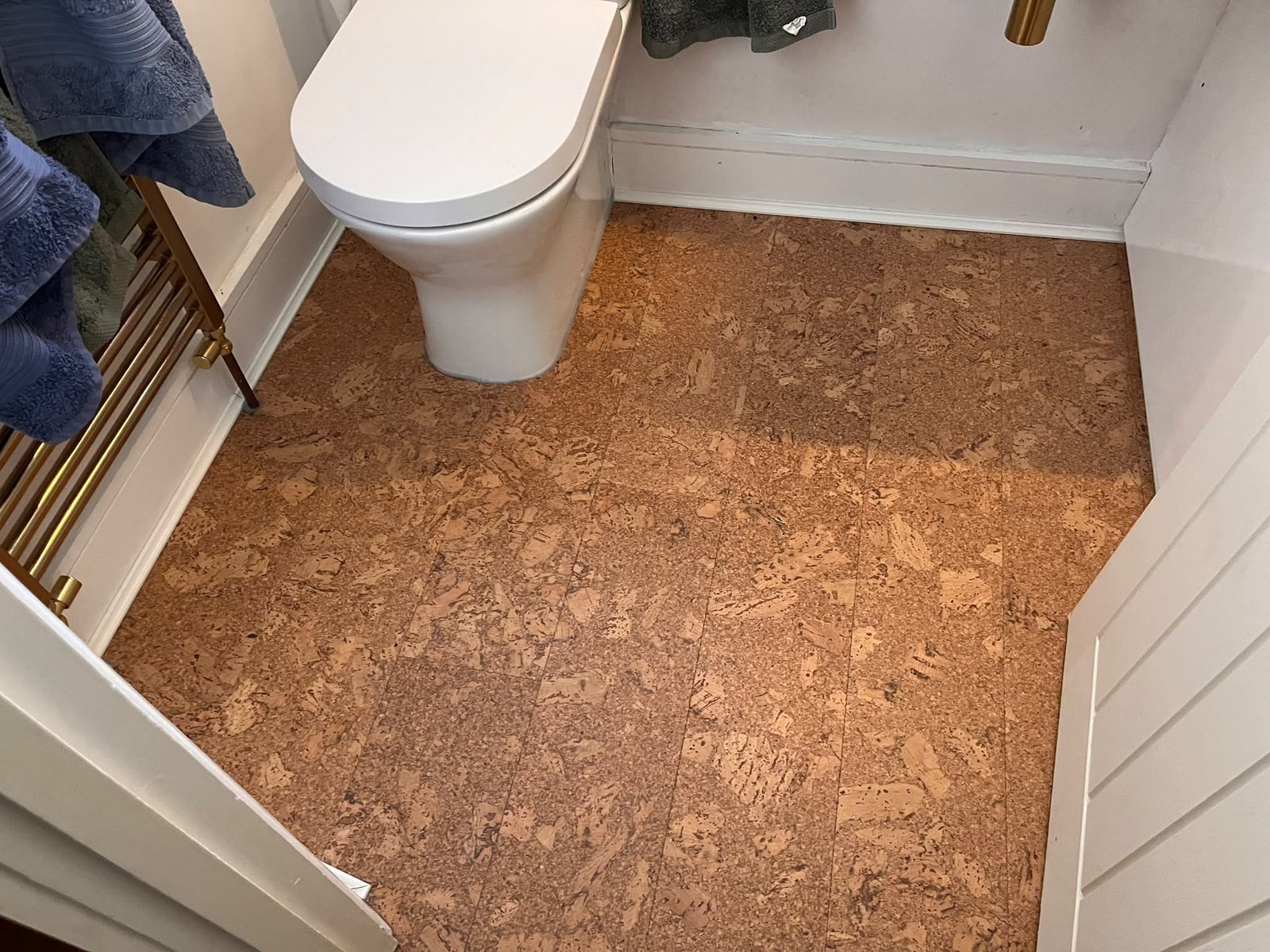 Cork tiles cut in around the WC