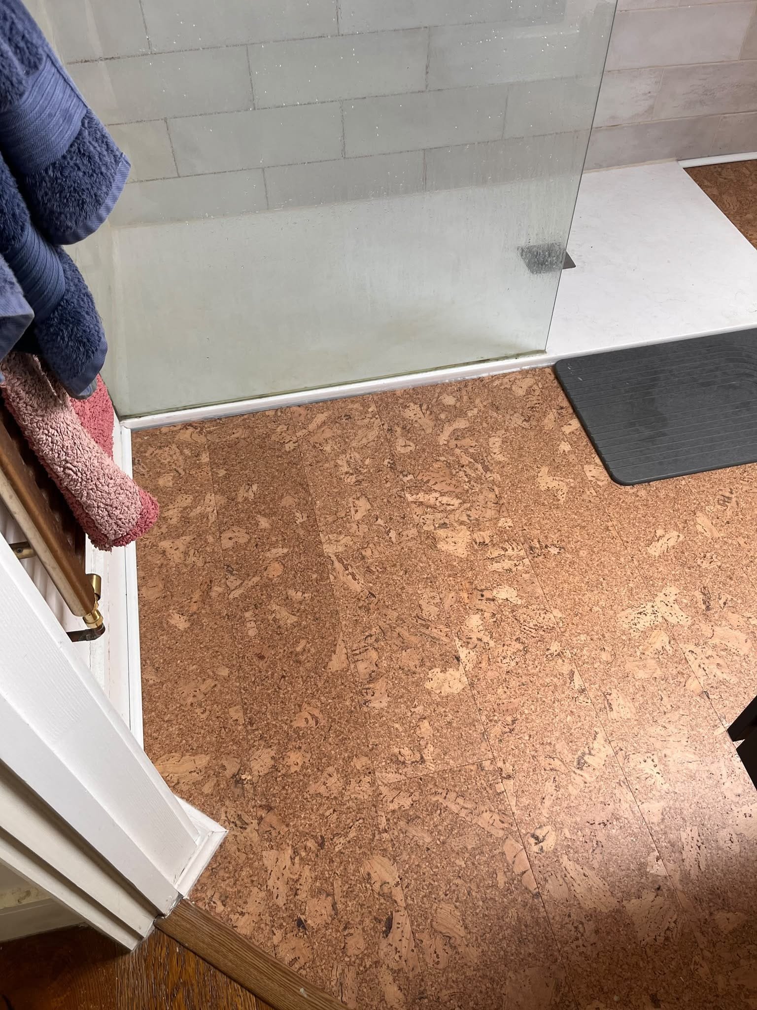 Neat cork-to-shower-tray detail